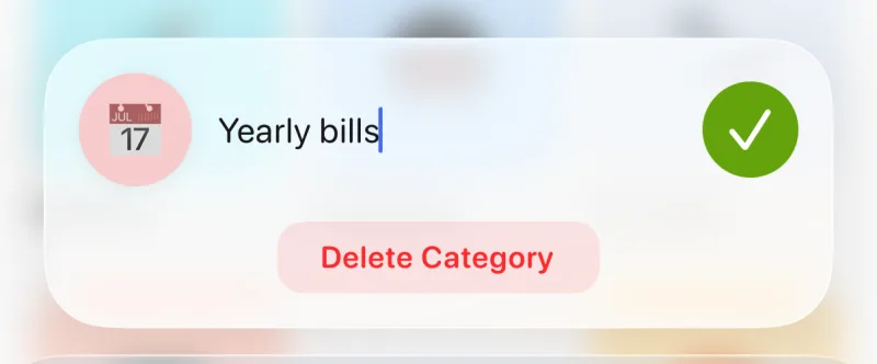 Tally's category editor open on Yearly bills: a floating card with the calendar emoji, the name field, a save check and a Delete Category button over the blurred category grid